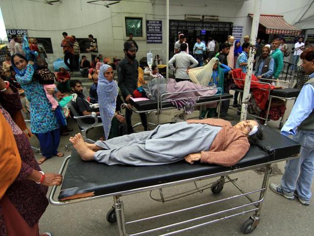 Patients and attendants were brought out from their wards after the earthquake in Jammu. (Nitin Kanotra /HT Photo)