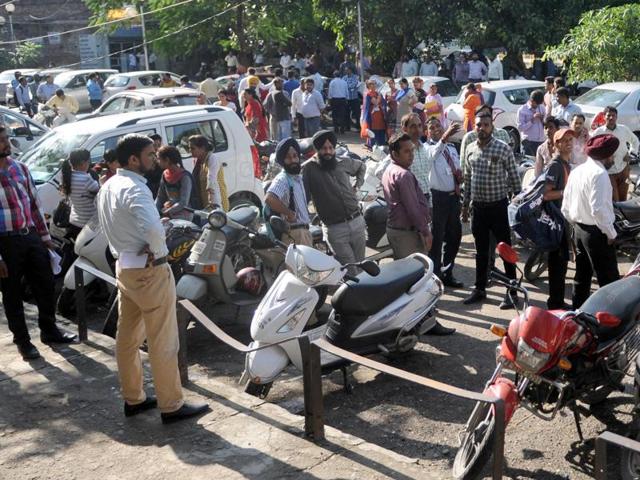 People outside their office after tremors were felt in Jalandhar. (HT Photo )