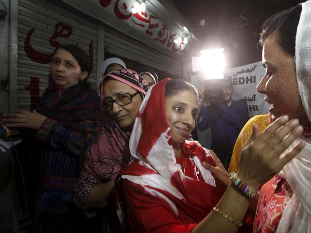 Geeta greets a journalist before leaving for an airport to depart for New Delhi. (Reuters Photo)