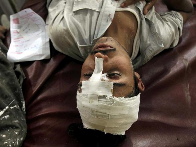 A man injured in an earthquake admits at a local hospital in Peshawar, Pakistan. (AP)