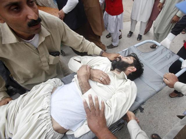Rescue workers move a man, who was injured during an earthquake, at the Lady Reading hospital in Peshawar, Pakistan. (REUTERS)