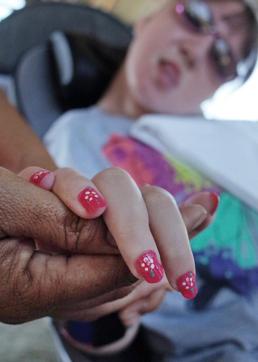 Charley has her fingernails painted. (AP) Charley has her fingernails painted. (AP)