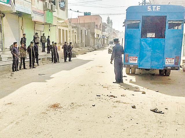 STF personnel patrol the closed Sridoongargarh market. (HT photo)