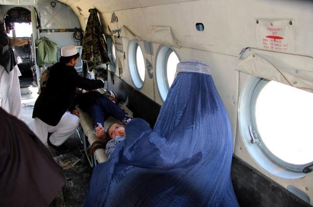 Afghan relatives sit with injured children inside an Afghan military helicopter at Takhar Province on after they were injured following a powerful earthquake that hit the Central Asian nation. (AFP) Afghan relatives sit with injured children inside an Afghan military helicopter at Takhar Province on after they were injured following a powerful earthquake that hit the Central Asian nation. (AFP)