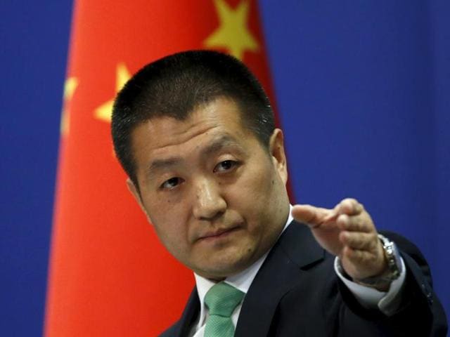 Chinese foreign ministry spokesperson Lu Kang points out a reporter to receive a question at a regular news conference in Beijing. The US Navy sent a guided-missile destroyer close to China's man-made islands in the disputed South China Sea, drawing an angry rebuke from Beijing, which said it warned and followed the American vessel. (Reuters Photo) Chinese foreign ministry spokesperson Lu Kang points out a reporter to receive a question at a regular news conference in Beijing. The US Navy sent a guided-missile destroyer close to China's man-made islands in the disputed South China Sea, drawing an angry rebuke from Beijing, which said it warned and followed the American vessel. (Reuters Photo)
