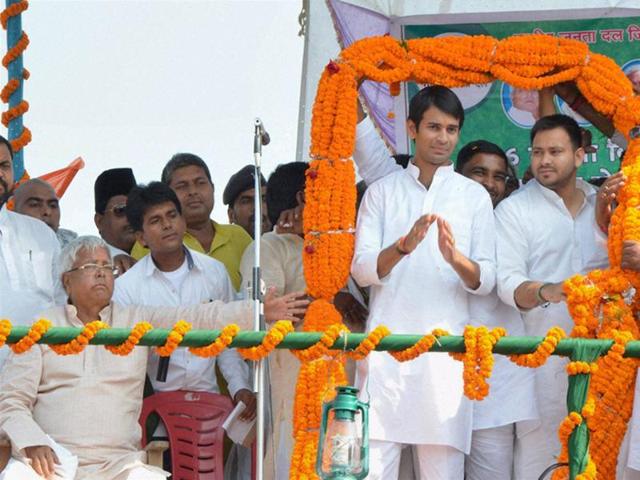 RJD chief Lalu Prasad with sons Tejaswi Yadav and Tej Pratap at a rally after the latter filed nomination papers from Mahula assembly constituency, in Hajipur. (PTI Photo) RJD chief Lalu Prasad with sons Tejaswi Yadav and Tej Pratap at a rally after the latter filed nomination papers from Mahula assembly constituency, in Hajipur. (PTI Photo)
