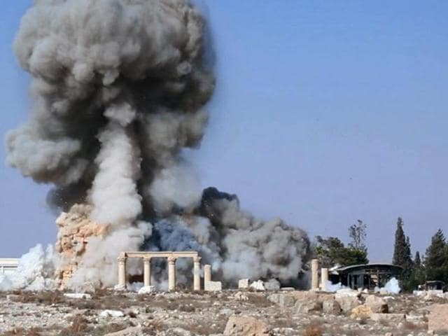 This undated photo released on a social media site used by Islamic State militants, which has been verified and is consistent with other AP reporting, shows smoke from the detonation of the 2,000-year-old temple of Baalshamin in Syria's ancient caravan city of Palmyra. (AP) This undated photo released on a social media site used by Islamic State militants, which has been verified and is consistent with other AP reporting, shows smoke from the detonation of the 2,000-year-old temple of Baalshamin in Syria's ancient caravan city of Palmyra. (AP)