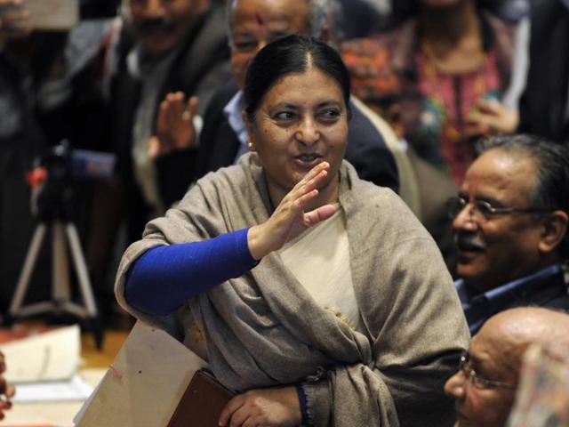 Nepalese presidential candidate nominated by the Communist Party of Nepal (Unified Marxist-Leninist) (CPN-UML) Bidhya Bhandari (C) waves after filing her candidacy papers for the Presidency in Kathmandu on October 27. (AFP) Nepalese presidential candidate nominated by the Communist Party of Nepal (Unified Marxist-Leninist) (CPN-UML) Bidhya Bhandari (C) waves after filing her candidacy papers for the Presidency in Kathmandu on October 27. (AFP)
