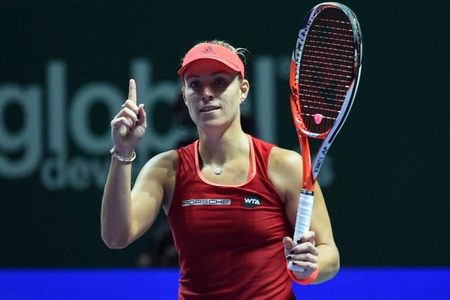 Germany's Angelique Kerber celebrates after beating Czech Republic's Petra Kvitova in their round-robin match at the WTA Finals in Singapore on October 26, 2015. (AFP Photo) Germany's Angelique Kerber celebrates after beating Czech Republic's Petra Kvitova in their round-robin match at the WTA Finals in Singapore on October 26, 2015. (AFP Photo)
