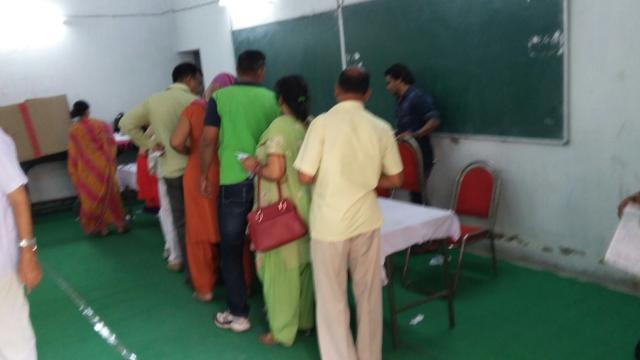 Very few voters standing in line at 12.30 PM in AN College which has 14 booths. (HT Photo) Very few voters standing in line at 12.30 PM in AN College which has 14 booths. (HT Photo)