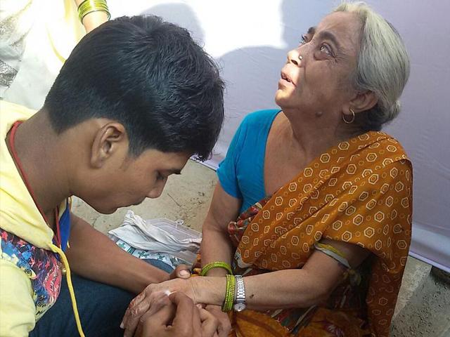 An old woman being treated after she was bitten by a monkey in Bakhtiarpur. (HT Photo)