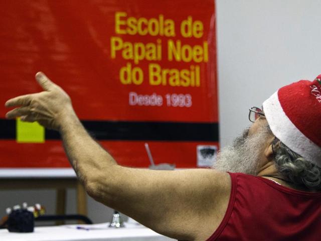 A retired worker attends a lesson at a school for Santa Claus in Rio de Janeiro to look for a job during Christmas season. (AFP)