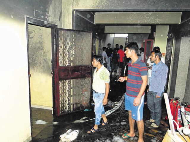 The fire broke out at Amrapali Village apartments in Nyay Khand 2 around 4pm on Monday. A garment workshop was being run illegally on the 10th floor of the building. (HT Photo) The fire broke out at Amrapali Village apartments in Nyay Khand 2 around 4pm on Monday. A garment workshop was being run illegally on the 10th floor of the building. (HT Photo)