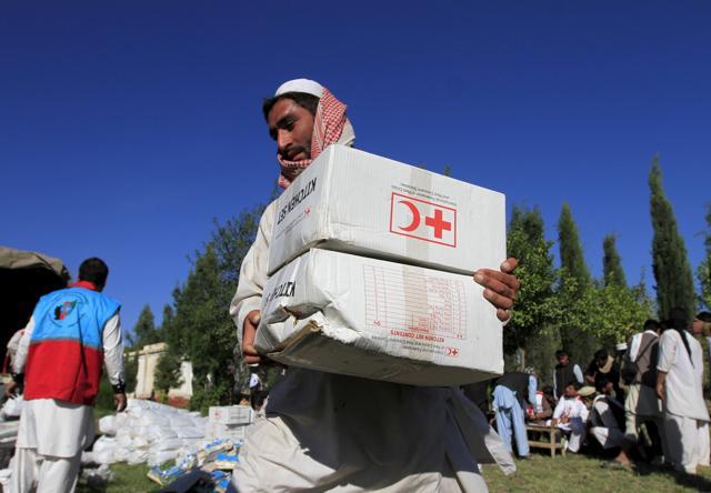 An Afghan man receives aid from the International Federation of the Red Cross and Red Crescent Societies after an earthquake, in Behsud district of Jalalabad province, Afghanistan. The Taliban urged aid agencies on Tuesday to push ahead in delivering emergency relief supplies after a major earthquake hit remote mountainous regions of northern Afghanistan and Pakistan. (Reuters Photo) An Afghan man receives aid from the International Federation of the Red Cross and Red Crescent Societies after an earthquake, in Behsud district of Jalalabad province, Afghanistan. The Taliban urged aid agencies on Tuesday to push ahead in delivering emergency relief supplies after a major earthquake hit remote mountainous regions of northern Afghanistan and Pakistan. (Reuters Photo)