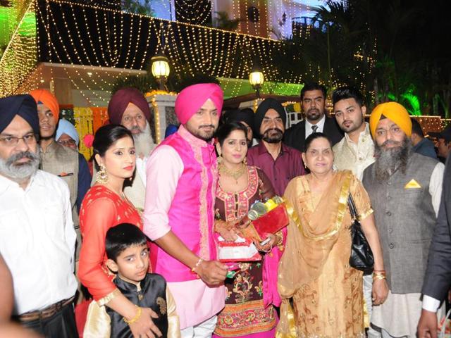 Harbhajan Singh with his family members while leaving for the celebration of sangeet celebrations in Phagwara, Punjab. (Pardeep Pandit/HT Photo)