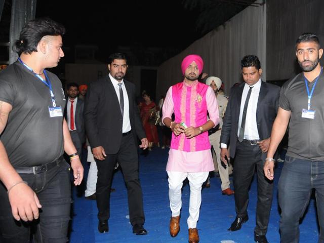 Harbhajan Singh with his family members while leaving for Geeta Basra's stay where the celebration of ladies sangeet will be held in a resort near Phagwara, Punjab on Tuesday. (Pardeep Pandit/HT Photo)