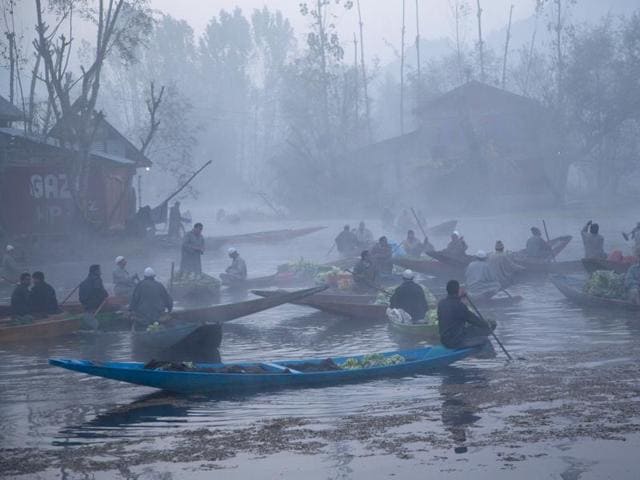 People take part in the first International Kashmir half marathon, at Foreshore road on the banks of Dal Lake in Srinagar. (PTI) People take part in the first International Kashmir half marathon, at Foreshore road on the banks of Dal Lake in Srinagar. (PTI)