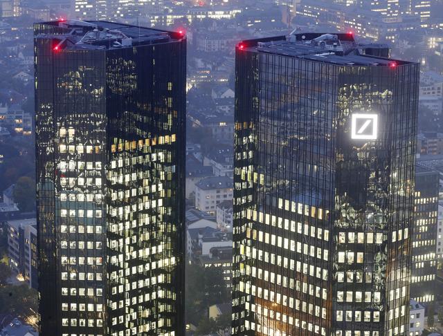 A file picture of the Deutsche Bank headquarters are photographed in Frankfurt, Germany. Germany’s biggest lender announced it had lost $6.6 billion in the third quarter, largely due to the fallen value of two of its major divisions, as well as legal costs. (AP Photo) A file picture of the Deutsche Bank headquarters are photographed in Frankfurt, Germany. Germany’s biggest lender announced it had lost $6.6 billion in the third quarter, largely due to the fallen value of two of its major divisions, as well as legal costs. (AP Photo)