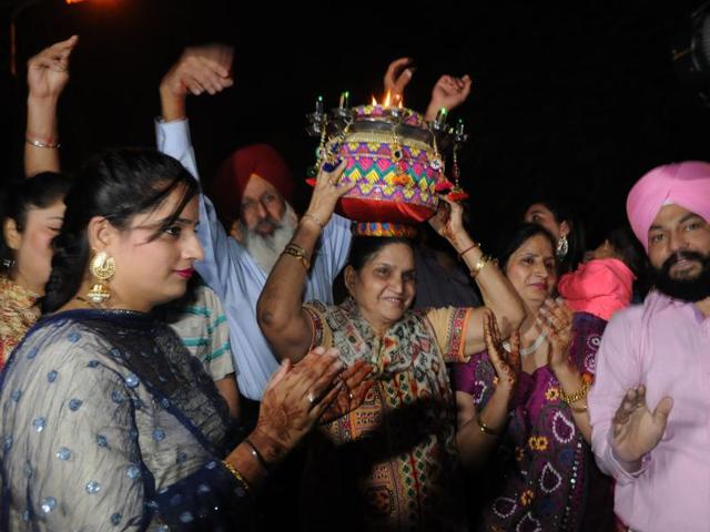 Avtar Kaur mother of Harbhajan Singh along with his younger sister Sandeep Kaur and relatives during Jago celebration on the eve of his marriage in Jalandhar on Wednesday, October 28, 2015. (Pardeep Pandit/HT Photo)