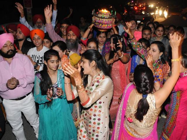 Relatives of Harbhajan SIngh in jubilant mood during Jago Celebration on the eve of his marriage in Jalandhar, India on Wednesday, October 28, 2015. (Pardeep Pandit/HT Photo)
