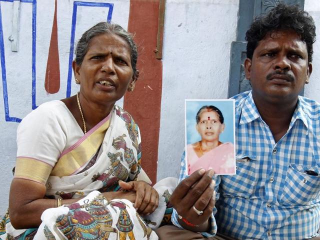 Malliga, sister, and Mohan, son of Kasthuri Munirathinam, display his mother’s photograph in Chennai. (AP) Malliga, sister, and Mohan, son of Kasthuri Munirathinam, display his mother’s photograph in Chennai. (AP)