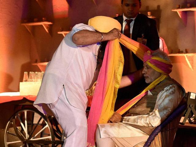 PM Narendra Modi has a turban tied before the dinner begins. This summit marks the India’s largest ever interaction with African leaders. (PTI Photo)