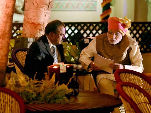 Prime Minister Narendra Modi meets with NSA Ajit Doval on the sidelines of the Pragati Maidan dinner. (PTI Photo)