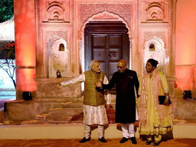 Prime Minister Narendra Modi with South African President Jacob Zuma and his wife Bongi Ngema, wearing traditional Indian dresses, at a dinner at Pragati Maidan. (PTI Photo)