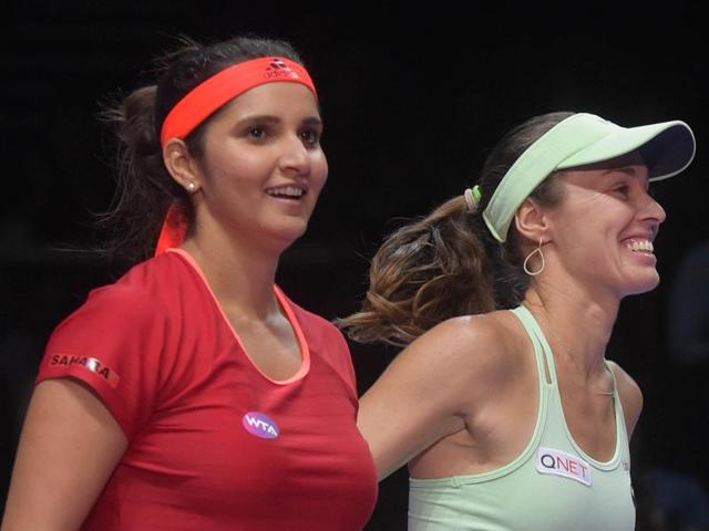 Sania Mirza and Martina Hingis during a changeover in their match against Andrea Hlavackova and Lucie Hradecka at the WTA Finals in Singapore on October 28, 2015.(AP Photo) Sania Mirza and Martina Hingis during a changeover in their match against Andrea Hlavackova and Lucie Hradecka at the WTA Finals in Singapore on October 28, 2015.(AP Photo)