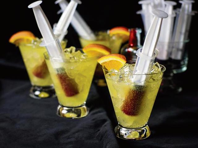 Insert the syringe in the class vertically (slanting a bit) and serve.