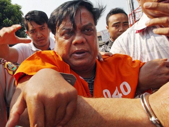 Chotta Rajan (centre) is escorted by plain-clothed police officers for questioning in Bali, Indonesia, on Thursday. (AP photo) Chotta Rajan (centre) is escorted by plain-clothed police officers for questioning in Bali, Indonesia, on Thursday. (AP photo)