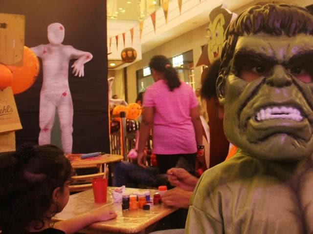 A child shows off his Hulk mask at the Halloween party in Lower Parel, Mumbai. (Pramod Thakur/HT photo)