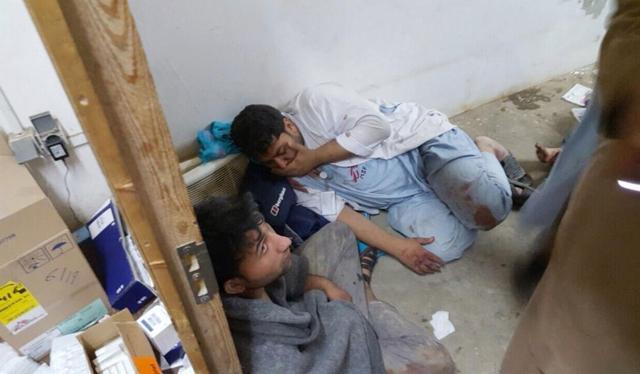 In this file photo, provided by Doctors Without Borders, injured Doctors Without Borders staff are seen near their hospital after it was hit by a US airstrike, in the northern Afghan city of Kunduz, Afghanistan. (AP Photo)