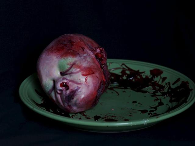 A bloody zombie baby head made of gummy candy and red jelly is pictured at the Zombie Gourmet homemade candy manufacturer on the outskirts of Mexico City October 30, 2015. (REUTERS)