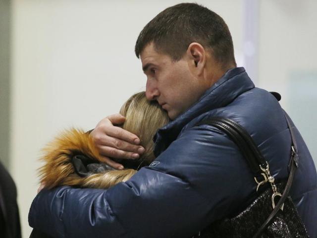 Relatives react after a Russian airliner with 217 passengers and seven crew aboard crashed, as people gather at Russian airline Kogalymavia’s information desk at Pulkovo airport in St.Petersburg, Russia. (AP Photo)