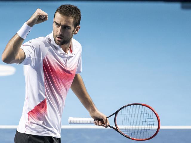 Marin Cilic raises a fist in celebration after winning a point. (AP Photo)