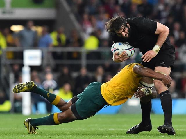 New Zealand's lock Sam Whitelock (R) is tackled by Australia's prop Sekope Kepu (L) during the final. (AFP)
