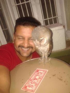 Nikhil Sanger in a selfie with a rescued owl.