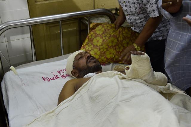 Bangladeshi writer Ranadipam Basuis is treated at the Dhaka medical college hospital after being attacked in the office of a publisher in Dhaka. (AFP)