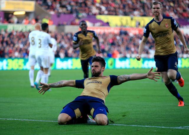 Arsenal's Olivier Giroud celebrates scoring his side's first goal of the EPL game against Swansea City at the Liberty Stadium in Swansea, Wales, on October 31, 2015. (AP Photo) Arsenal's Olivier Giroud celebrates scoring his side's first goal of the EPL game against Swansea City at the Liberty Stadium in Swansea, Wales, on October 31, 2015. (AP Photo)