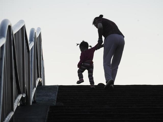 A girl walks with her grandmother at a market in Beijing, China, in this November 25, 2013 file photo. China will ease family planning restrictions to allow all couples to have two children after decades of the strict one-child policy, the ruling Communist Party said on October 29, 2015, a move aimed at alleviating demographic strains on the economy. (Reuters Photo) A girl walks with her grandmother at a market in Beijing, China, in this November 25, 2013 file photo. China will ease family planning restrictions to allow all couples to have two children after decades of the strict one-child policy, the ruling Communist Party said on October 29, 2015, a move aimed at alleviating demographic strains on the economy. (Reuters Photo)