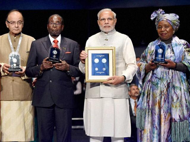 President Pranab Mukherjee, vice president Hamid Ansari and Prime Minister Narendra Modi in a group photograph with the heads of delegations of the third India Africa Forum Summit at Rashtrapati Bhavan, in (PTI Photo) President Pranab Mukherjee, vice president Hamid Ansari and Prime Minister Narendra Modi in a group photograph with the heads of delegations of the third India Africa Forum Summit at Rashtrapati Bhavan, in (PTI Photo)