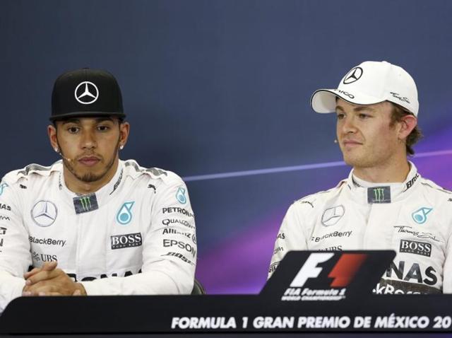 Mercedes Formula One drivers Lewis Hamilton of Britain, right, and Nico Rosberg of Germany pose with Ferrari driver Sebastian Vettel of Germany, left, after qualifying for the Mexican Grand Prix at the Autodromo Hermanos Rodriguez in Mexico City, on October 31, 2015. (Reuters Photo) Mercedes Formula One drivers Lewis Hamilton of Britain, right, and Nico Rosberg of Germany pose with Ferrari driver Sebastian Vettel of Germany, left, after qualifying for the Mexican Grand Prix at the Autodromo Hermanos Rodriguez in Mexico City, on October 31, 2015. (Reuters Photo)