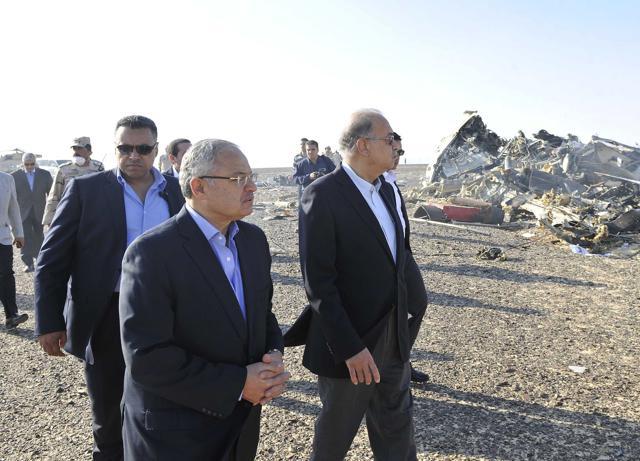 Prime Minister of Egypt Sherif Ismail, centre, visits the site where the plane crashed in Hassana, Egypt. (AP) Prime Minister of Egypt Sherif Ismail, centre, visits the site where the plane crashed in Hassana, Egypt. (AP)