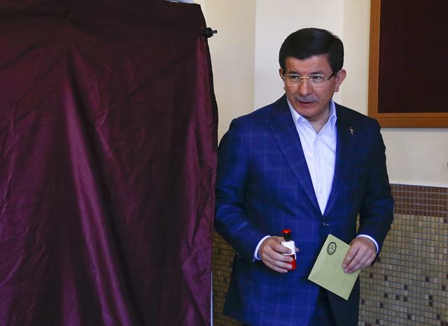 Turkish Prime Minister Ahmet Davutoglu leaves a booth after casting his ballot. (REUTERS) Turkish Prime Minister Ahmet Davutoglu leaves a booth after casting his ballot. (REUTERS)