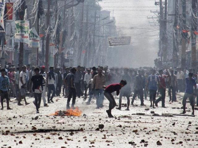 Ethnic Madhesi protesters throw stones and bricks at Nepalese policemen in Birgunj, a town on the border with India, Nepal, Monday, Nov. 2, 2015. Ethnic protesters demonstrating against the new constitution clashed with police in south Nepal Monday which left at least one person killed and several more injured, officials said. (AP) Ethnic Madhesi protesters throw stones and bricks at Nepalese policemen in Birgunj, a town on the border with India, Nepal, Monday, Nov. 2, 2015. Ethnic protesters demonstrating against the new constitution clashed with police in south Nepal Monday which left at least one person killed and several more injured, officials said. (AP)