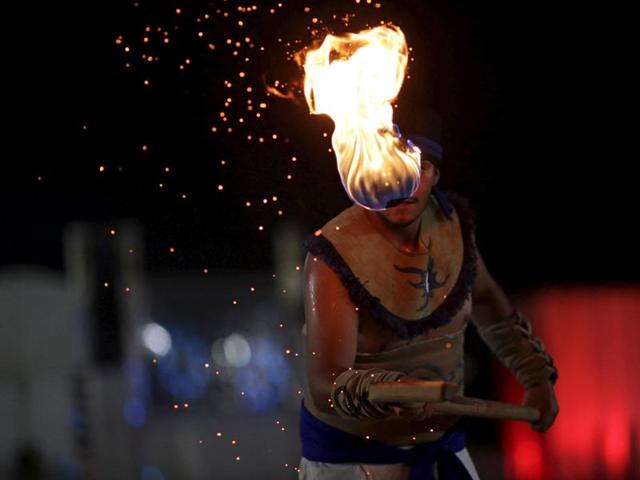 An indigenous man from Mexico performs a Mexican game known as La Batalla (a hockey-like game that uses a fireball) during the first World Games for Indigenous Peoples in Palmas, Brazil. (REUTERS) An indigenous man from Mexico performs a Mexican game known as La Batalla (a hockey-like game that uses a fireball) during the first World Games for Indigenous Peoples in Palmas, Brazil. (REUTERS)