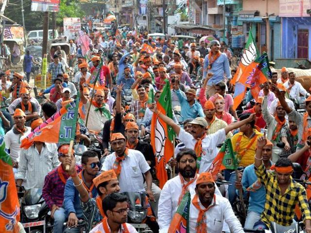 BJP activists take out a road show. (PTI file photo) BJP activists take out a road show. (PTI file photo)