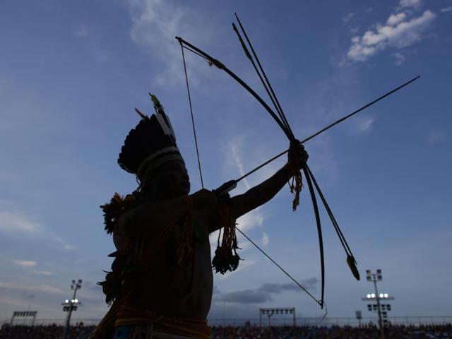 A man of the Paresi ethnic group, from Brazil, prepares his bow during the final games of the World Indigenous Games. (AP) A man of the Paresi ethnic group, from Brazil, prepares his bow during the final games of the World Indigenous Games. (AP)