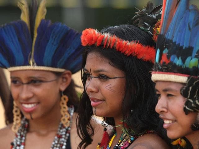 Terena indigenous women from Brazil look on before the start of the canoe event at the World Indigenous Games in Palmas. (AP) Terena indigenous women from Brazil look on before the start of the canoe event at the World Indigenous Games in Palmas. (AP)